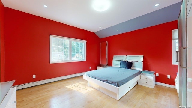 bedroom with light wood-type flooring, vaulted ceiling, baseboard heating, and billiards