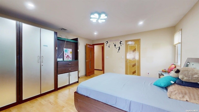 bedroom with light wood-type flooring