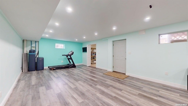 workout area featuring light wood-type flooring