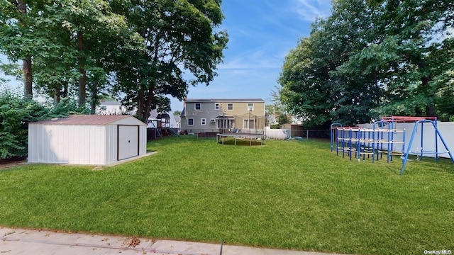 view of yard with a playground, a shed, and a trampoline