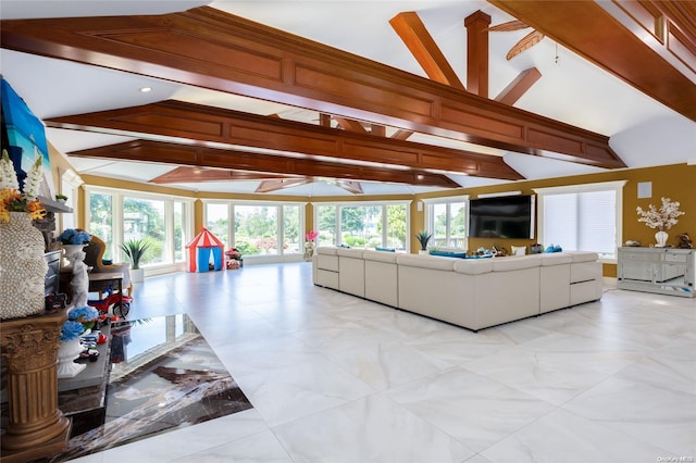 living room with vaulted ceiling with beams and a wealth of natural light