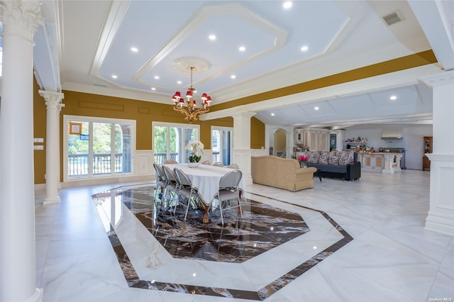 dining area with decorative columns, crown molding, and an inviting chandelier