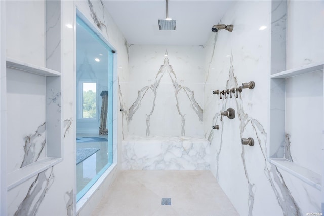 bathroom featuring a tile shower