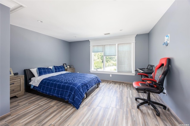 bedroom featuring hardwood / wood-style flooring