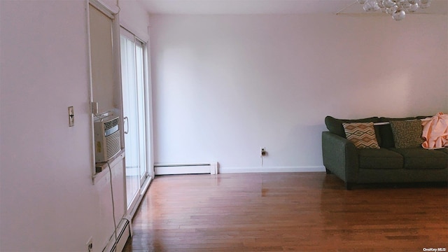 interior space featuring baseboard heating and dark hardwood / wood-style floors