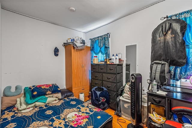 bedroom featuring hardwood / wood-style flooring