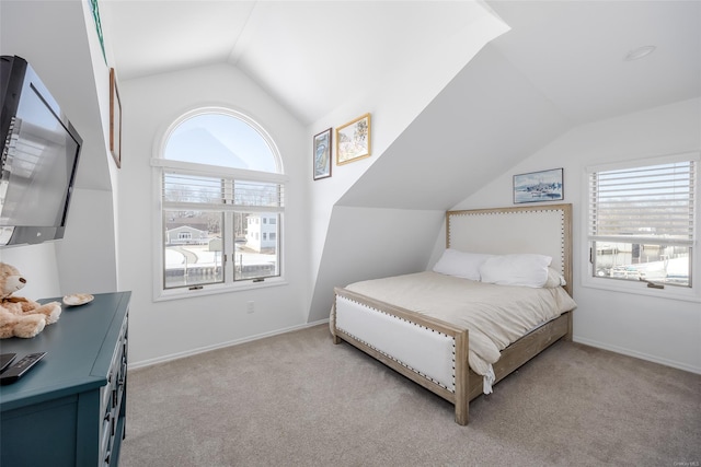 carpeted bedroom with vaulted ceiling