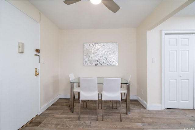 dining space featuring hardwood / wood-style flooring and ceiling fan