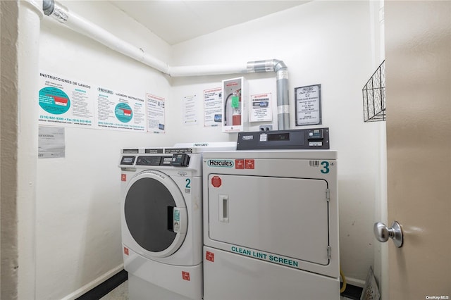 laundry area featuring washing machine and clothes dryer