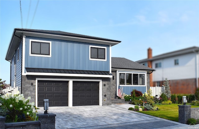 view of front of home with a garage