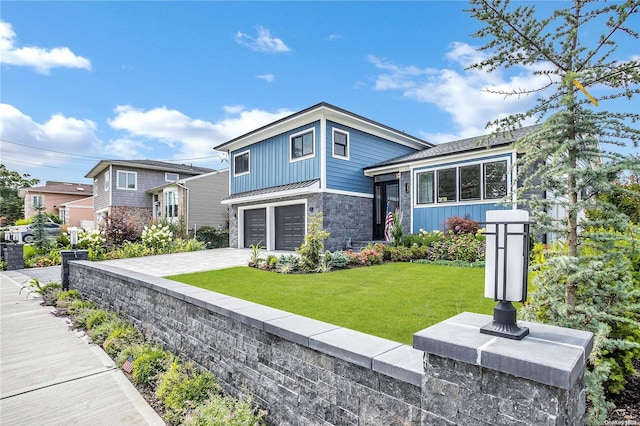 view of front of house with a garage and a front yard