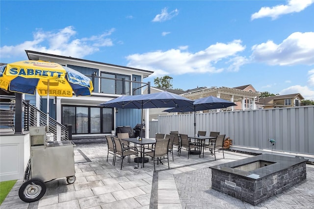 view of patio featuring a fire pit