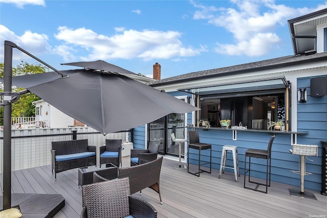 wooden terrace featuring an outdoor bar