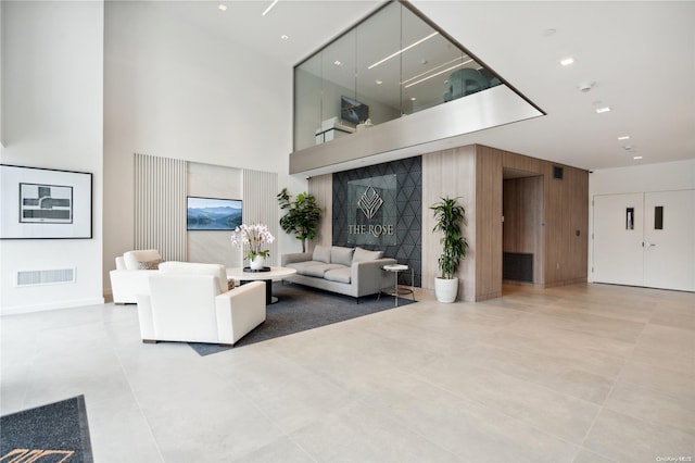 218 Middle Neck Rd Unit 107, Great Neck, NY 11021 - lobby featuring a high ceiling and wooden walls