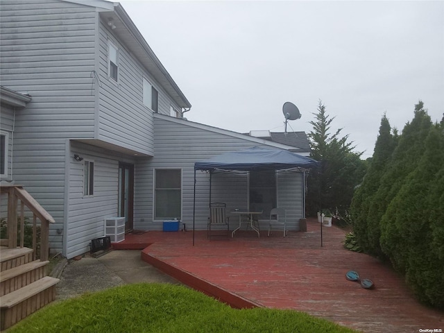 wooden terrace featuring a gazebo