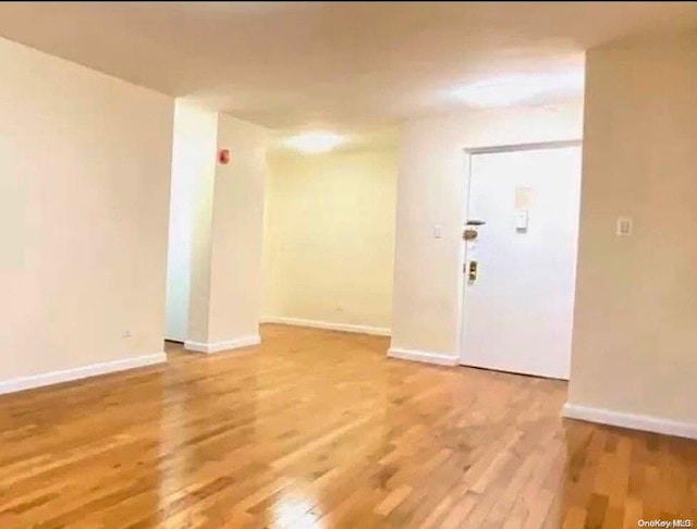 spare room featuring hardwood / wood-style flooring