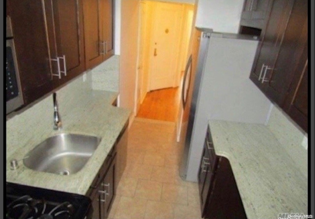 kitchen featuring light stone countertops