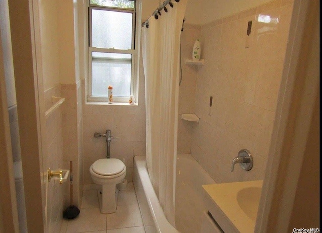 bathroom featuring tile patterned flooring, toilet, tile walls, and shower / tub combo with curtain