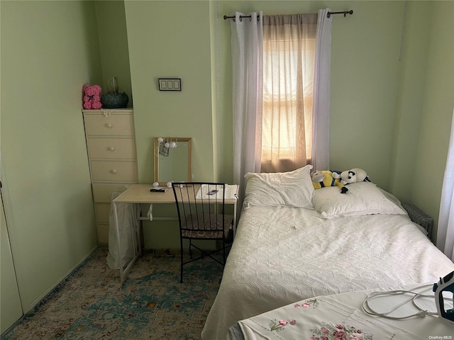 bedroom featuring radiator heating unit