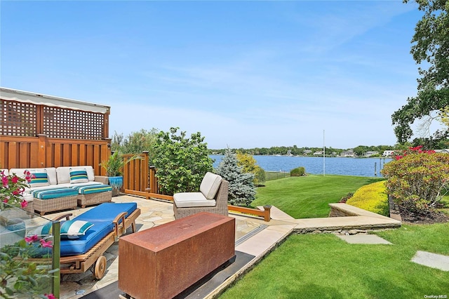 view of patio / terrace with outdoor lounge area and a water view