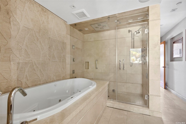 bathroom featuring tile patterned floors and independent shower and bath