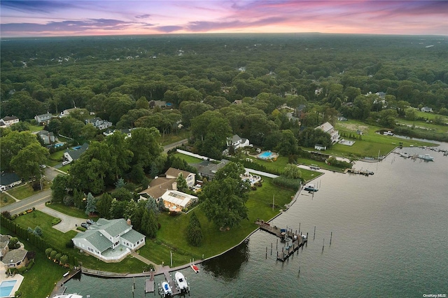 aerial view at dusk with a water view