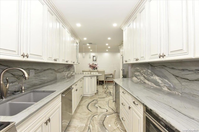 kitchen with light stone countertops, dishwasher, sink, tasteful backsplash, and white cabinets