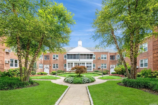 view of community with a lawn