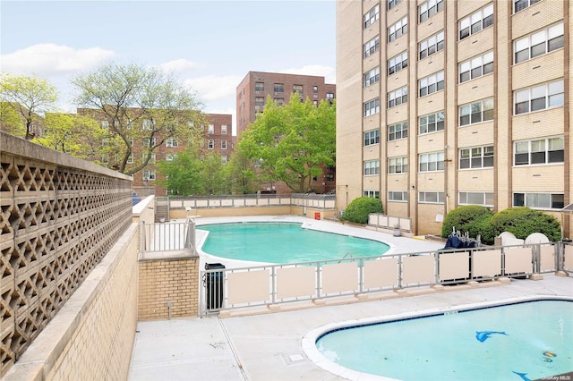 102-10 66th Rd Unit 4G, Forest Hills, NY 11375 - view of pool with a patio