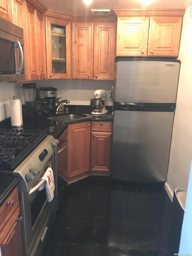 102-10 66th Rd Unit 4G, Forest Hills, NY 11375 - kitchen with dark tile patterned flooring, sink, and appliances with stainless steel finishes