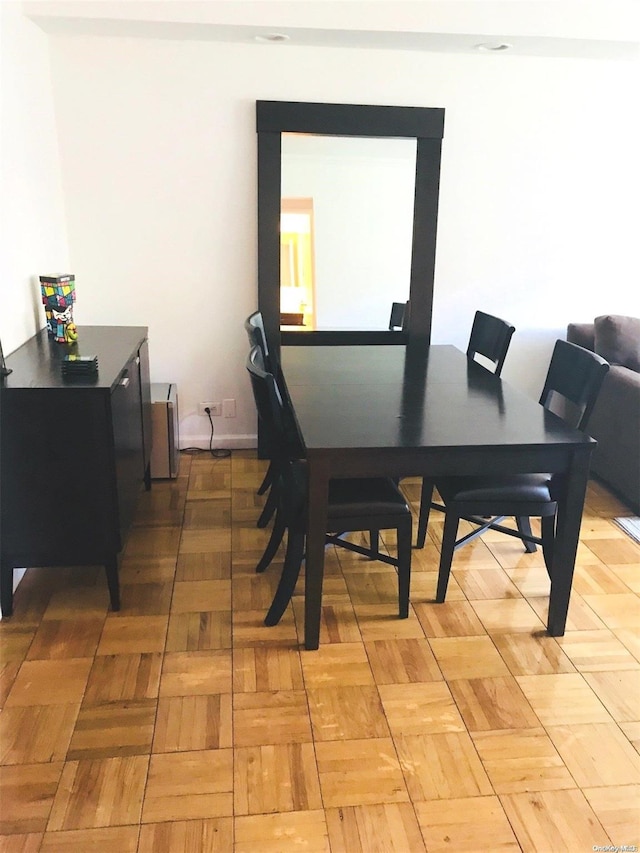 102-10 66th Rd Unit 4G, Forest Hills, NY 11375 - dining area featuring parquet flooring