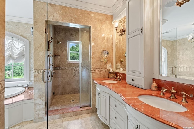 bathroom featuring vanity, ornamental molding, and independent shower and bath