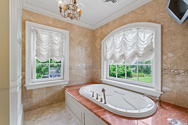 bathroom with a tub to relax in, a wealth of natural light, crown molding, and a notable chandelier