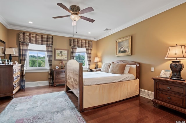 bedroom featuring ceiling fan, dark wood-type flooring, and multiple windows