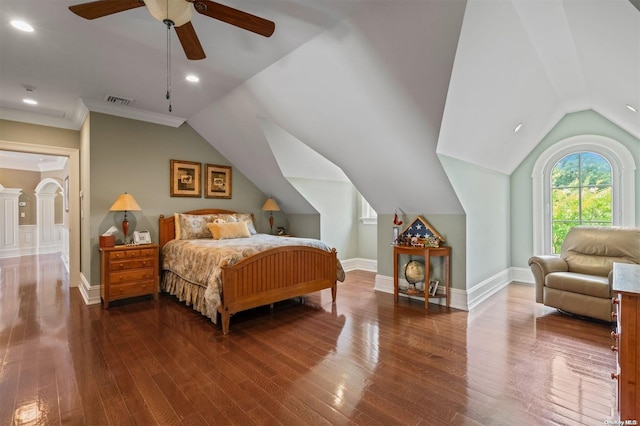 bedroom featuring ceiling fan, ornamental molding, vaulted ceiling, and hardwood / wood-style flooring