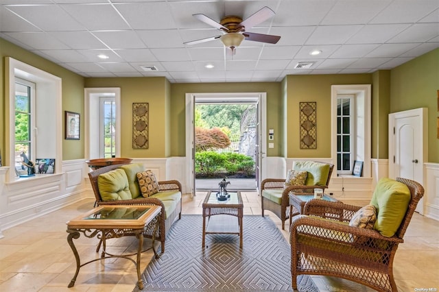 sitting room featuring ceiling fan