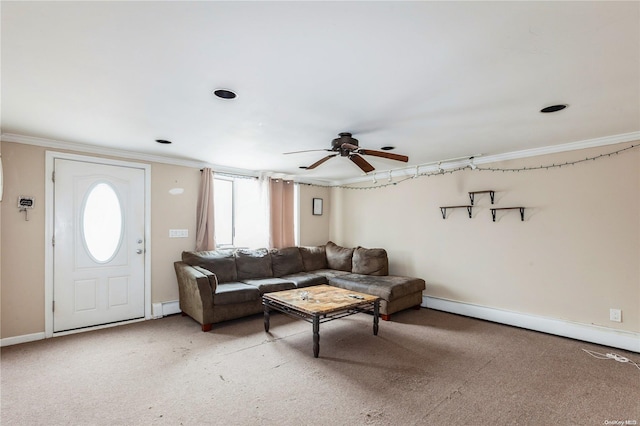 living room with carpet flooring, baseboard heating, ceiling fan, and ornamental molding