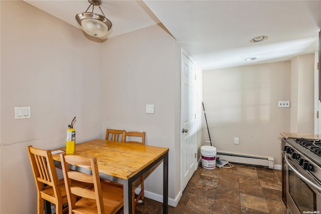 dining space featuring baseboard heating