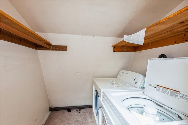 laundry area featuring light colored carpet and washing machine and clothes dryer