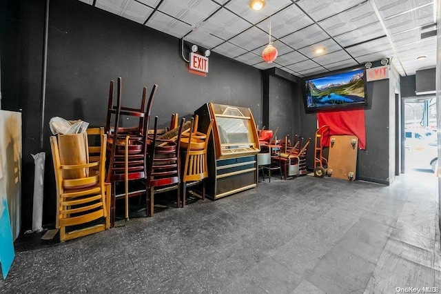 interior space featuring a paneled ceiling