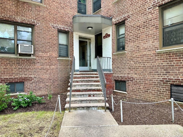 entrance to property featuring cooling unit