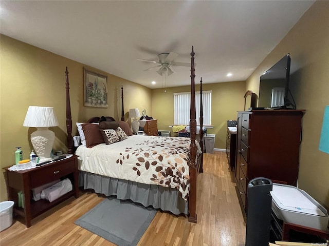 bedroom featuring ceiling fan and light hardwood / wood-style flooring