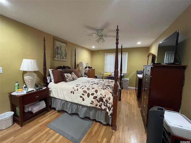 bedroom with ceiling fan and light hardwood / wood-style flooring