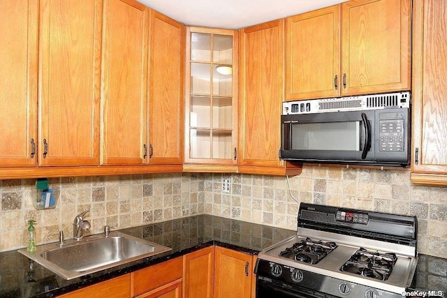 kitchen featuring backsplash, sink, and stainless steel gas range