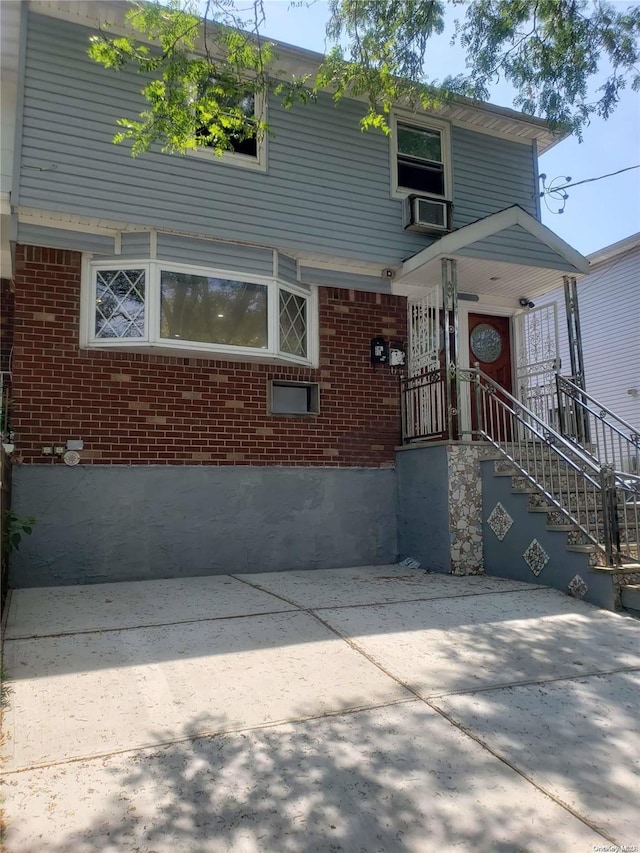 view of front of house featuring cooling unit