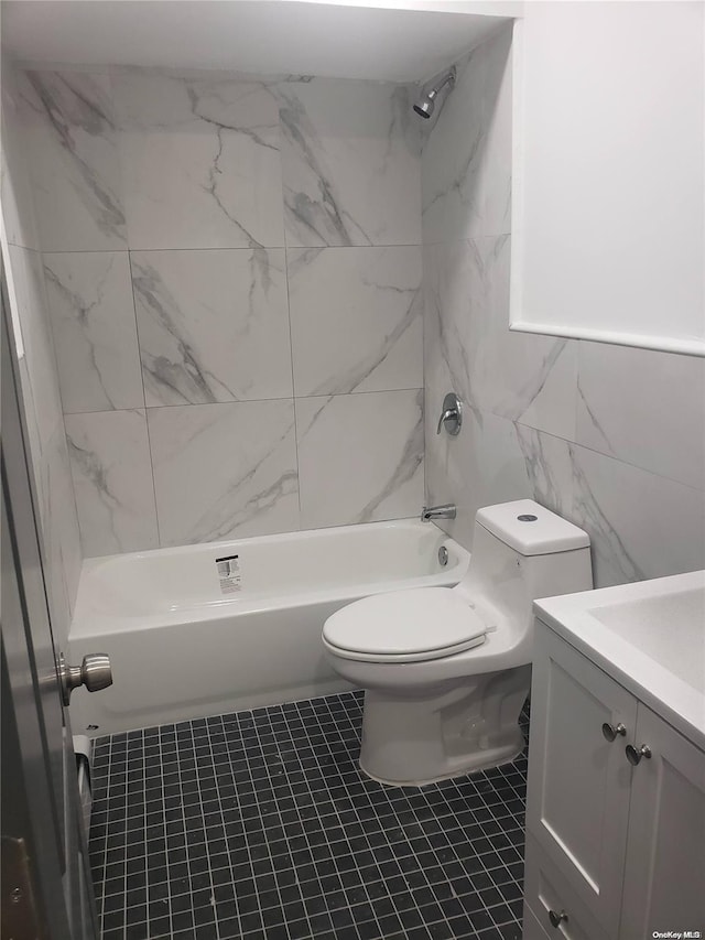 full bathroom with vanity, toilet, shower / bath combination, and tile walls