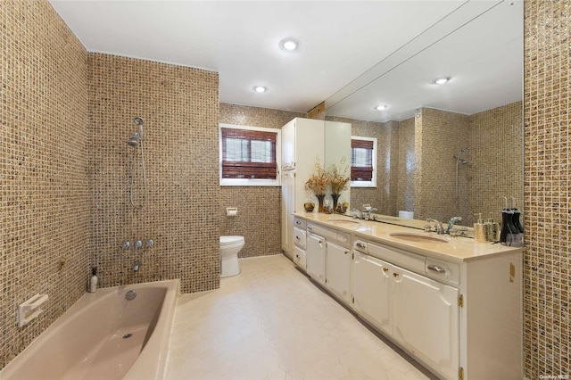 full bathroom with washtub / shower combination, vanity, tile walls, and toilet