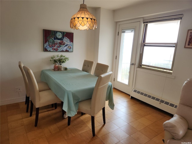 dining area featuring a baseboard radiator