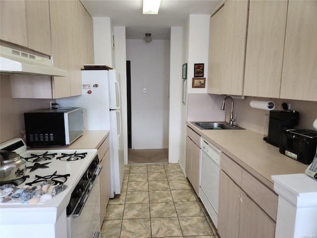 kitchen featuring light brown cabinets, light tile patterned floors, and white appliances