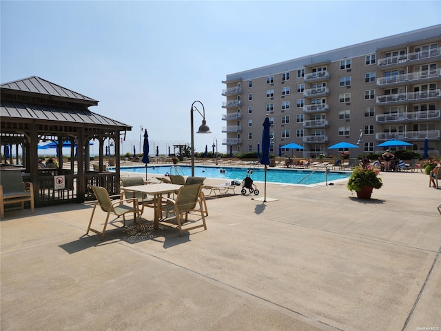 view of swimming pool featuring a gazebo